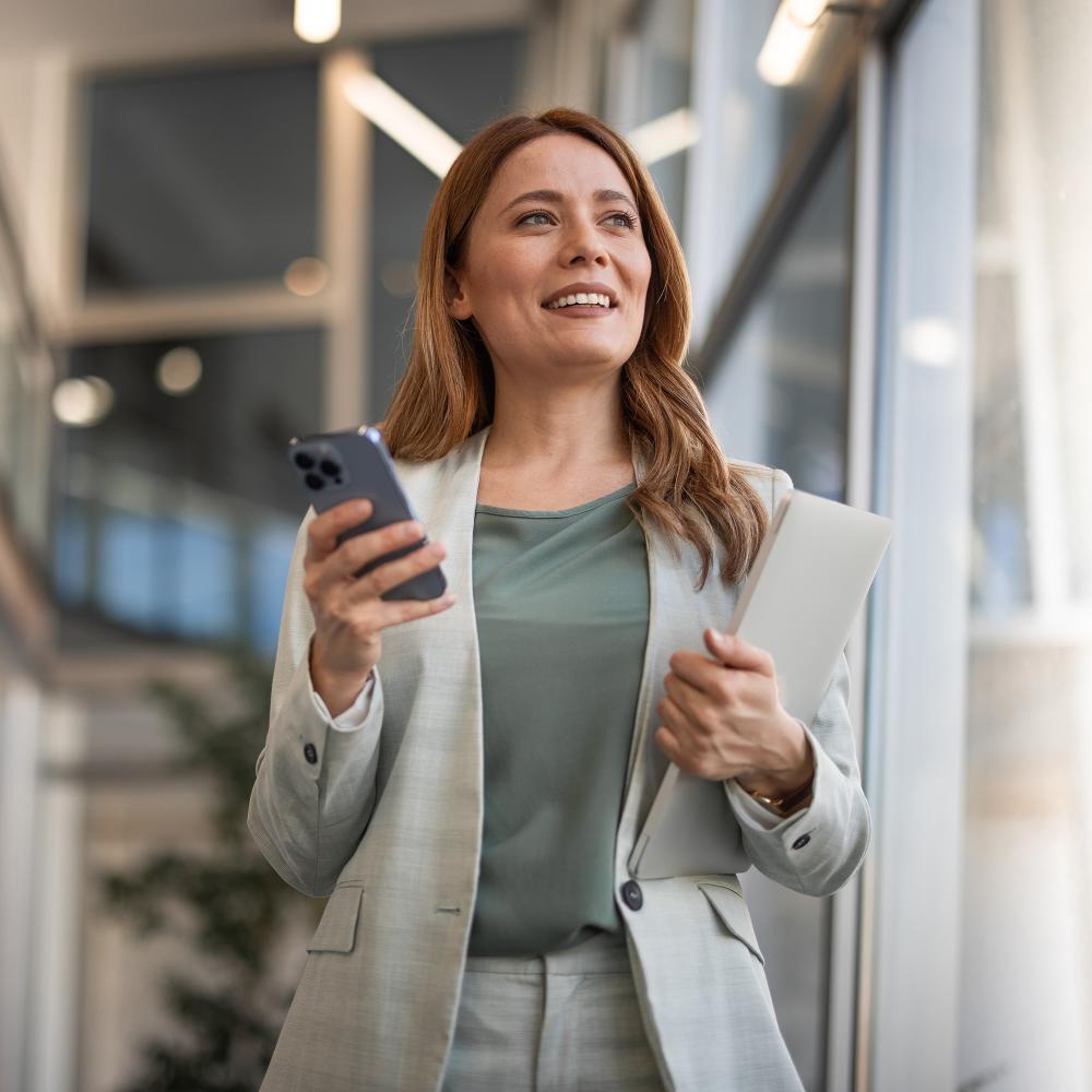 Herzing University online finance degree student representing leadership and career growth in a modern business setting.